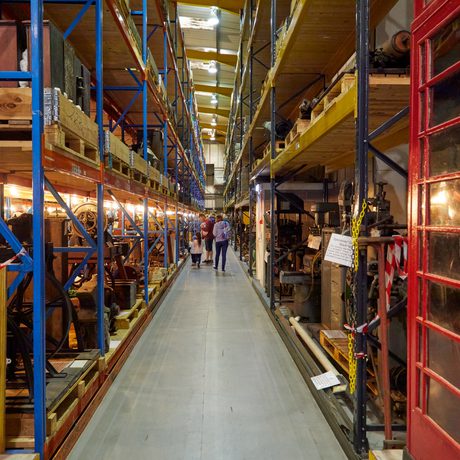 Warehouse racks containing old examples of machinery