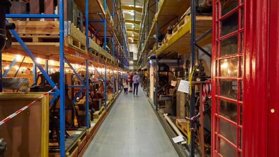 Warehouse racks containing old examples of machinery
