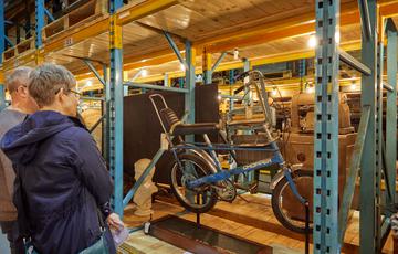 A person looking at a bike on display.