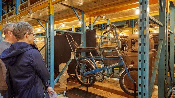 A person looking at a bike on display.