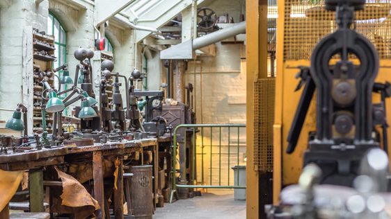 A jewellery workshop with machinery and work benches.