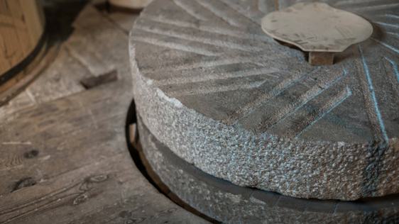Interior of mill showing close up of the millstones