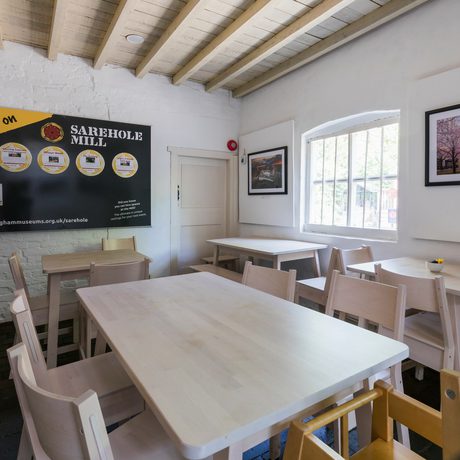 Interior view of a tearoom with chairs and tables.