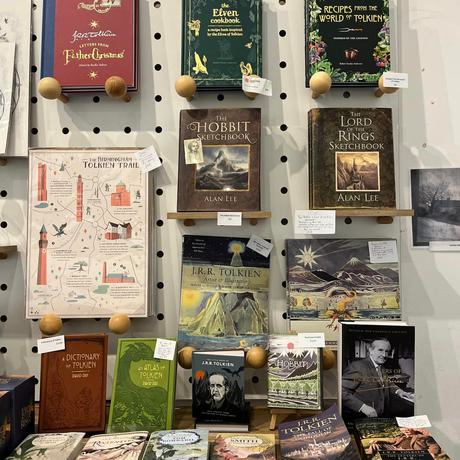 A selection of books on display in a shop including books by JRR Tolkien.