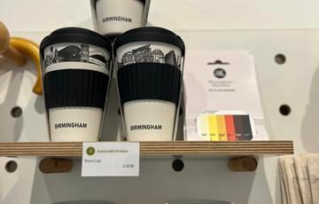 A selection travel coffee cups and mugs on display in the shop.
