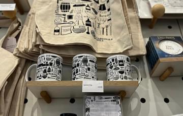 A selection of illustrated Birmingham products on display in a shop.