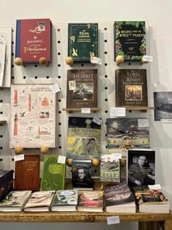 A selection of books on display in a shop including books by JRR Tolkien.