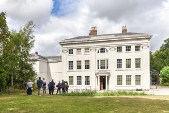 Soho House, a white Georgian House, with a group of people outside