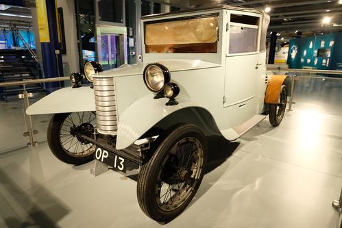 The front of a pale grey car dating from 1927 on display at Thinktank.