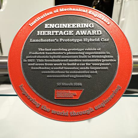 An Engineering Hertiage Award on display to the side of the Lanchester car.