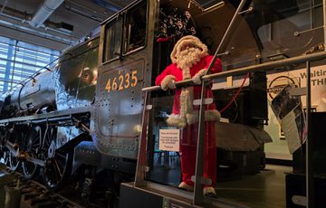 Santa standing on the 'City of Birmingham' train.