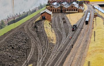 Model railway tracks with train.