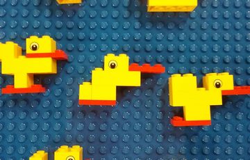 Lego ducks on a wall