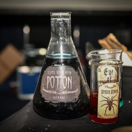 Halloween bottles and test tubes with 'potion' and spider labels.