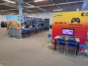 Inside Gamesworld with rows of computers and chairs.