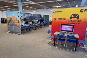 Inside Gamesworld with rows of computers and chairs.