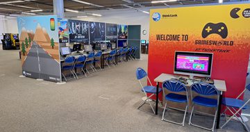 Inside Gamesworld with rows of computers and chairs.