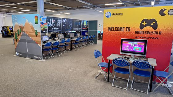 Inside Gamesworld with rows of computers and chairs.