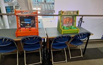 Two gaming stations featuring Donkey Kong and Turtles in Gamesworld.
