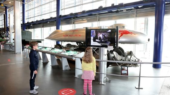 Two children looking at the Railton Land Speed Record car.