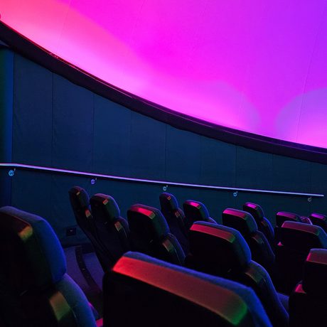 Seats in an empty planetarium.