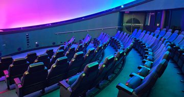 Seats in an empty planetarium.