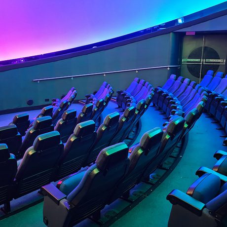 Seats in an empty planetarium.