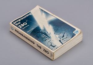 An instruction manual with lightening bolt hitting the ground. The heading reads 'Programming the Z80'.