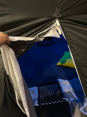 The zip is open showing the inside of the planetarium.