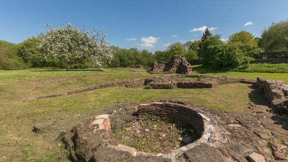 Close up of round section of castle ruins, lined with tiles